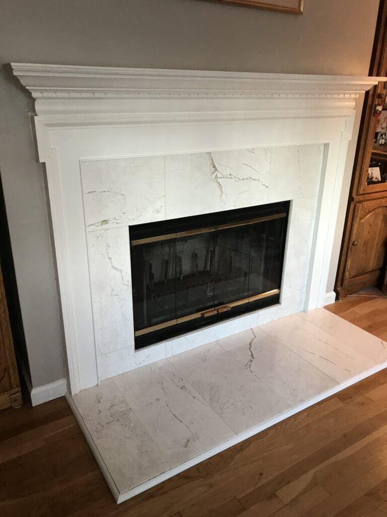 White marble wood burning fireplace