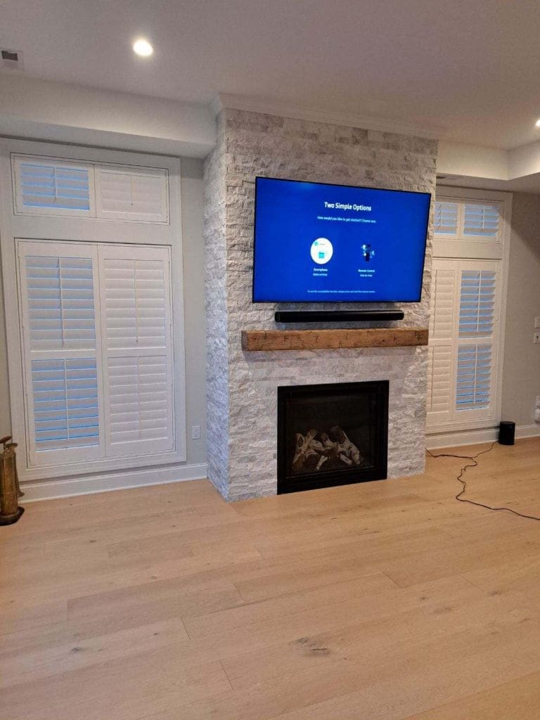 Gas Fireplace With Ledgestone and Wooden Beam