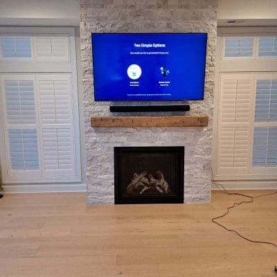 Gas Fireplace With Ledgestone and Wooden Beam